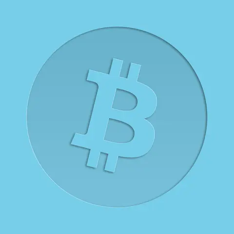 Bitcoin symbol embossed on a blue metal surface